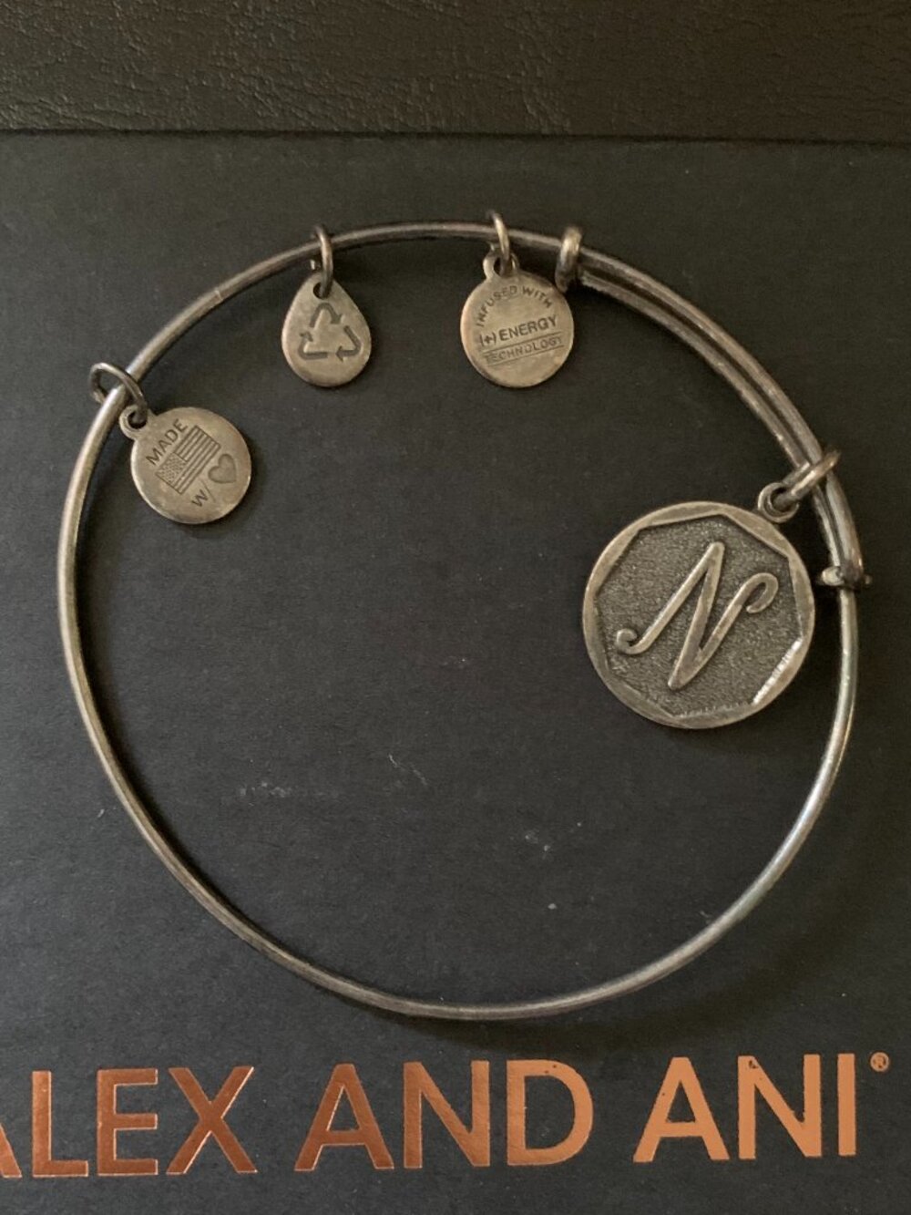 bracelet with charms, darker in color than photo shows